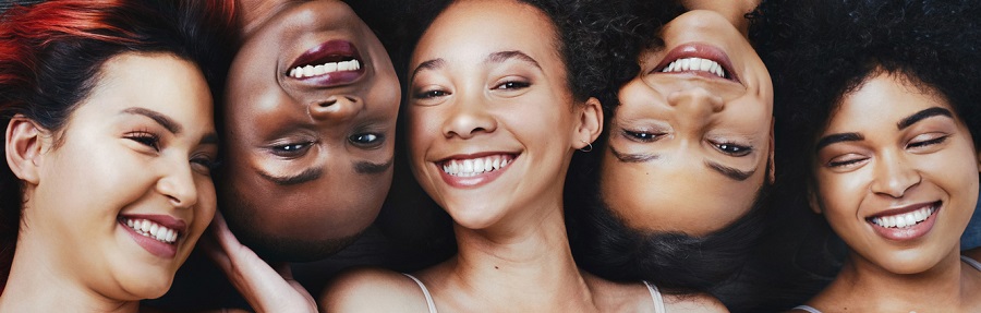 High angle shot of a group of beautiful young women lying next to each other